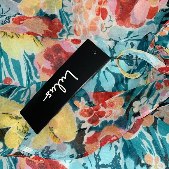 Lulu’s Feel Alive Teal Green Floral Print
Ruffled Dress - NWT - Picture 6 of 6